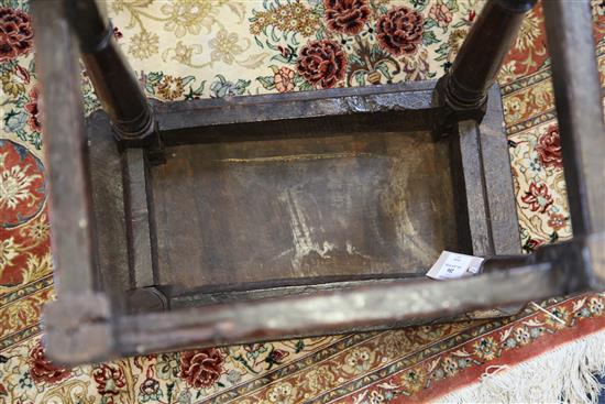 A 17th century oak joynt stool, incised with the initials W. R. 1ft. 7in. H.1ft 9in.